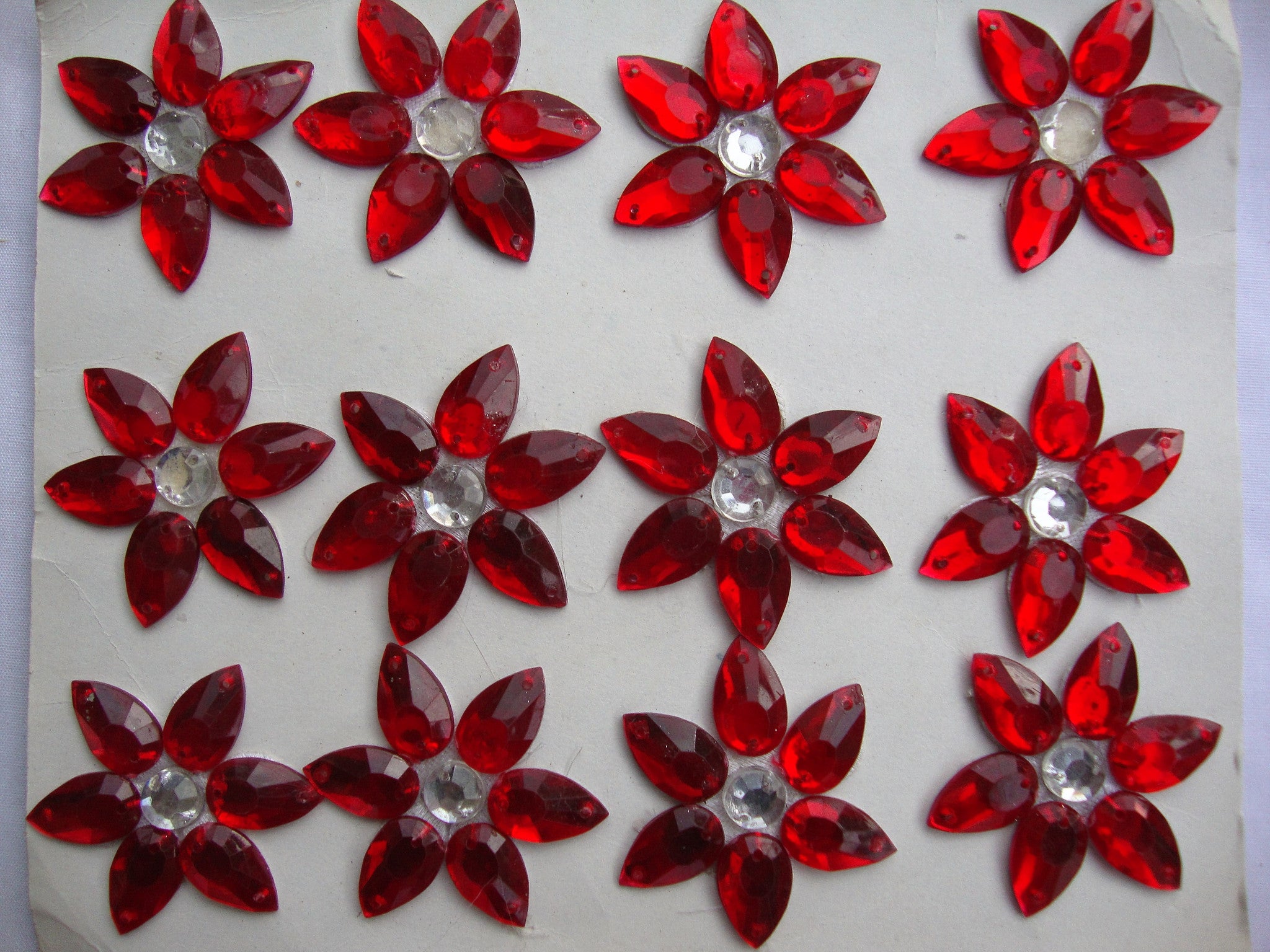 Red star shaped stones (Sold as a pack of 24)